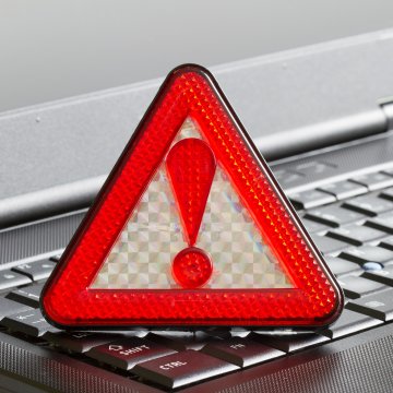 advanced system repair pro red alert triangle on computer keyboard virus alert